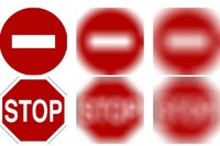 Imatge del senyal STOP amb bona visió i amb alguna deficiència visual